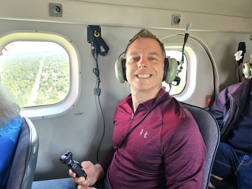 Unforgettable Alaska Flightseeing: A Journey Over Denali National Park 23 Cruising with Danny and Peter, Holland America Line, Westerdam, Anchorage, Alaska, United States | Aerial view of Denali, North America's tallest peak, and the majestic Alaska Range, captured during a Denali National Park flightseeing tour from Anchorage. The image also shows the stunning Ruth Glacier, a specialized plane with skis landing on Denali's snowy terrain, and wildlife such as moose grazing and beluga whales swimming in Cook Inlet.