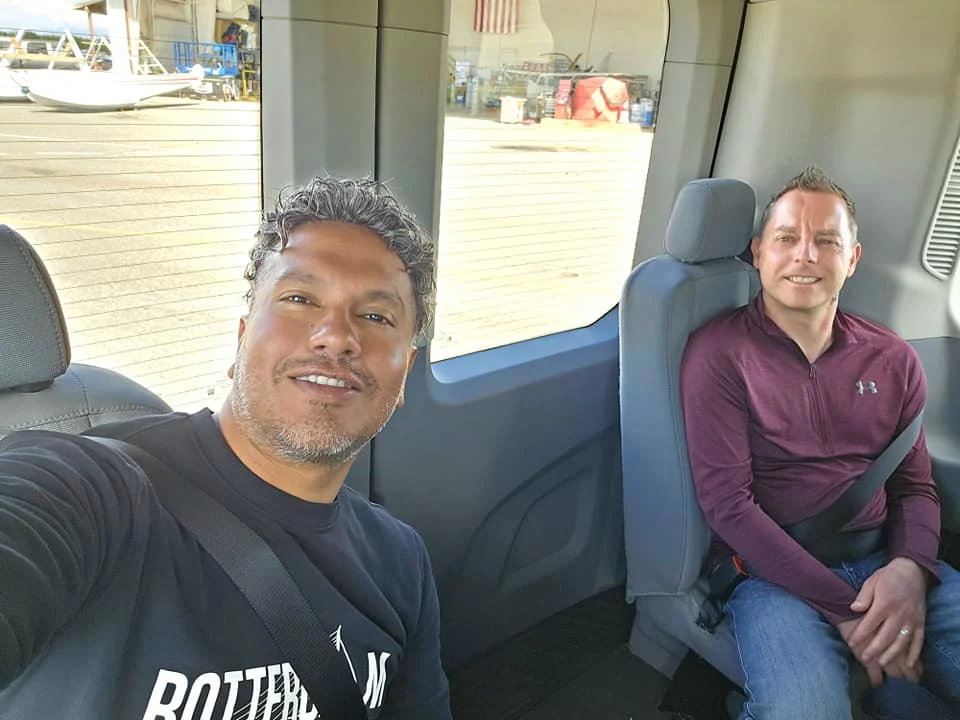 Unforgettable Alaska Flightseeing: A Journey Over Denali National Park 79 Cruising with Danny and Peter, Holland America Line, Westerdam, Anchorage, Alaska, United States | Aerial view of Denali, North America's tallest peak, and the majestic Alaska Range, captured during a Denali National Park flightseeing tour from Anchorage. The image also shows the stunning Ruth Glacier, a specialized plane with skis landing on Denali's snowy terrain, and wildlife such as moose grazing and beluga whales swimming in Cook Inlet.