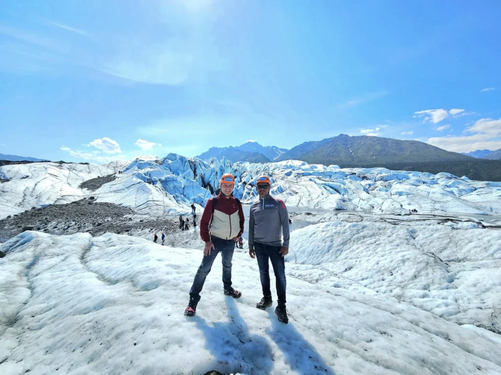 Cruising with Danny and Peter, Holland America Line, Westerdam, Anchorage, Alaska, United States | Experience the Matanuska Glacier Tour with stunning views of the glacier’s vast ice formations, an all-terrain vehicle ride, thrilling glacier hikes, and the unique refreshment of drinking crystal-clear glacial water, all complemented by stops at charming local eateries offering authentic Alaskan cuisine.