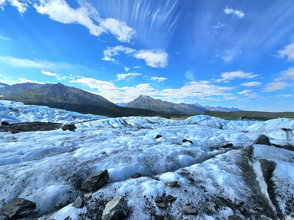 Cruising with Danny and Peter, Holland America Line, Westerdam, Anchorage, Alaska, United States | Experience the Matanuska Glacier Tour with stunning views of the glacier’s vast ice formations, an all-terrain vehicle ride, thrilling glacier hikes, and the unique refreshment of drinking crystal-clear glacial water, all complemented by stops at charming local eateries offering authentic Alaskan cuisine.