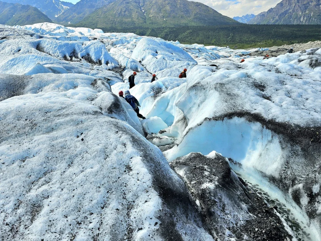 Cruising with Danny and Peter, Holland America Line, Westerdam, Anchorage, Alaska, United States | Experience the Matanuska Glacier Tour with stunning views of the glacier’s vast ice formations, an all-terrain vehicle ride, thrilling glacier hikes, and the unique refreshment of drinking crystal-clear glacial water, all complemented by stops at charming local eateries offering authentic Alaskan cuisine.