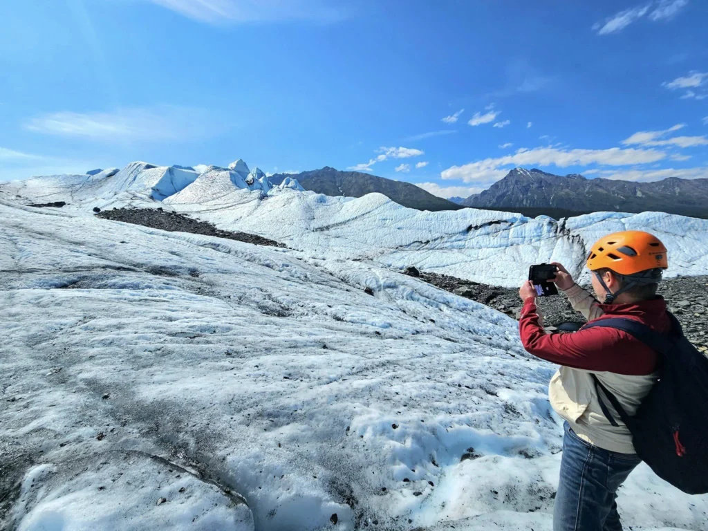 Cruising with Danny and Peter, Holland America Line, Westerdam, Anchorage, Alaska, United States | Experience the Matanuska Glacier Tour with stunning views of the glacier’s vast ice formations, an all-terrain vehicle ride, thrilling glacier hikes, and the unique refreshment of drinking crystal-clear glacial water, all complemented by stops at charming local eateries offering authentic Alaskan cuisine.