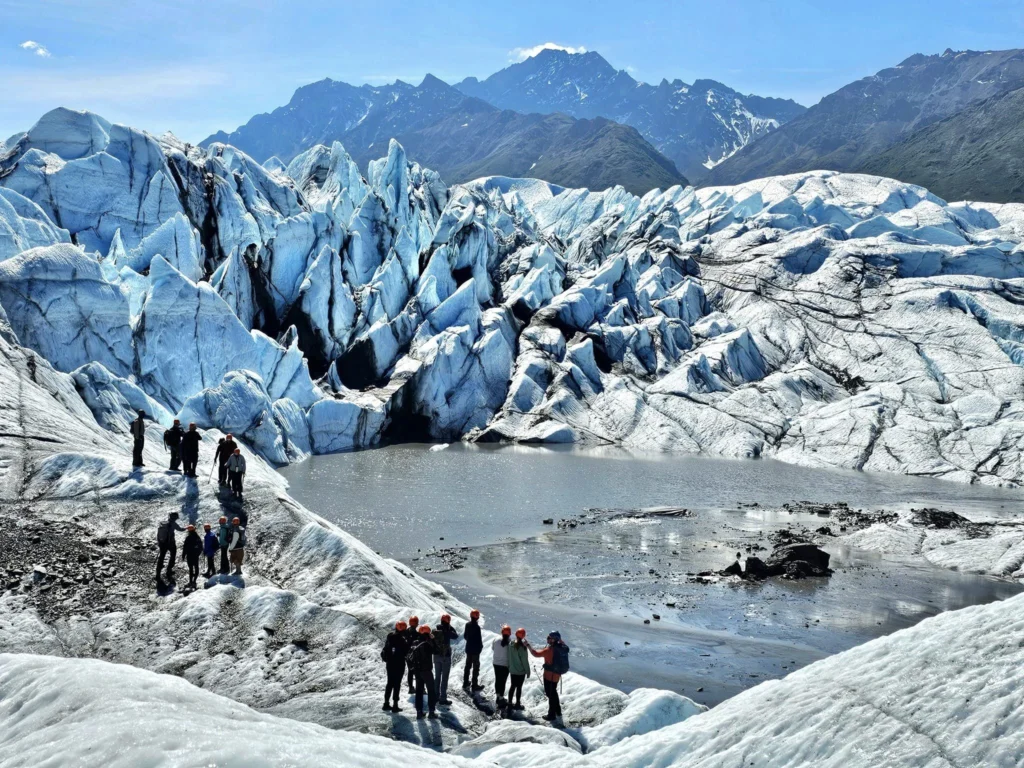 Cruising with Danny and Peter, Holland America Line, Westerdam, Anchorage, Alaska, United States | Experience the Matanuska Glacier Tour with stunning views of the glacier’s vast ice formations, an all-terrain vehicle ride, thrilling glacier hikes, and the unique refreshment of drinking crystal-clear glacial water, all complemented by stops at charming local eateries offering authentic Alaskan cuisine.