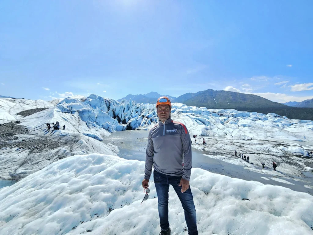 Cruising with Danny and Peter, Holland America Line, Westerdam, Anchorage, Alaska, United States | Experience the Matanuska Glacier Tour with stunning views of the glacier’s vast ice formations, an all-terrain vehicle ride, thrilling glacier hikes, and the unique refreshment of drinking crystal-clear glacial water, all complemented by stops at charming local eateries offering authentic Alaskan cuisine.