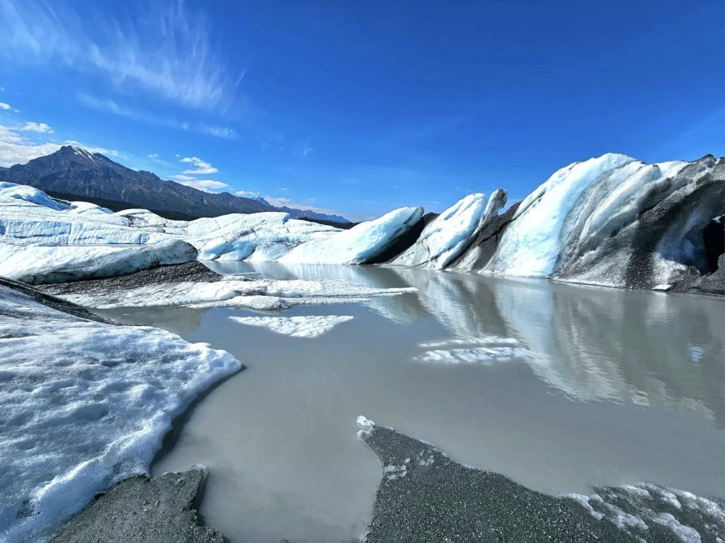 Cruising with Danny and Peter, Holland America Line, Westerdam, Anchorage, Alaska, United States | Experience the Matanuska Glacier Tour with stunning views of the glacier’s vast ice formations, an all-terrain vehicle ride, thrilling glacier hikes, and the unique refreshment of drinking crystal-clear glacial water, all complemented by stops at charming local eateries offering authentic Alaskan cuisine.