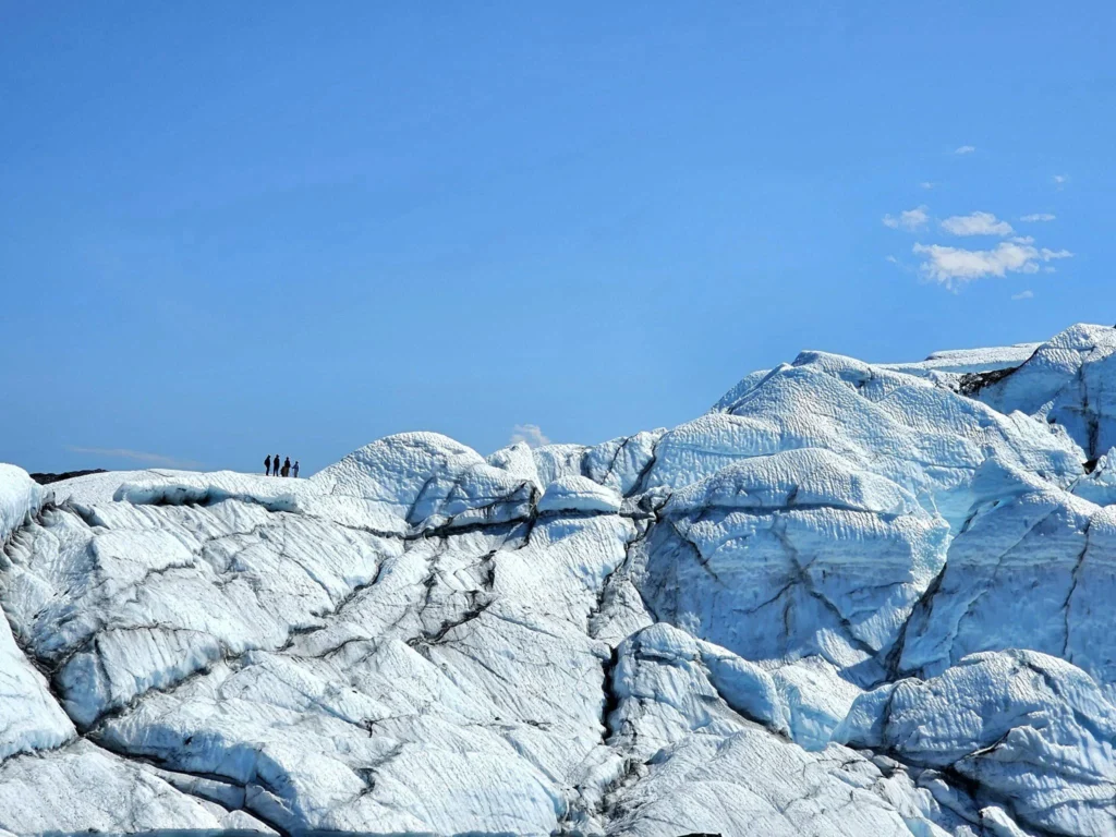 Cruising with Danny and Peter, Holland America Line, Westerdam, Anchorage, Alaska, United States | Experience the Matanuska Glacier Tour with stunning views of the glacier’s vast ice formations, an all-terrain vehicle ride, thrilling glacier hikes, and the unique refreshment of drinking crystal-clear glacial water, all complemented by stops at charming local eateries offering authentic Alaskan cuisine.