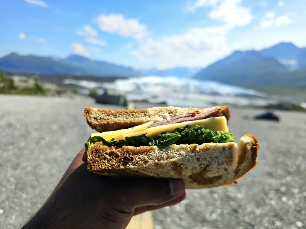 Cruising with Danny and Peter, Holland America Line, Westerdam, Anchorage, Alaska, United States | Experience the Matanuska Glacier Tour with stunning views of the glacier’s vast ice formations, an all-terrain vehicle ride, thrilling glacier hikes, and the unique refreshment of drinking crystal-clear glacial water, all complemented by stops at charming local eateries offering authentic Alaskan cuisine.