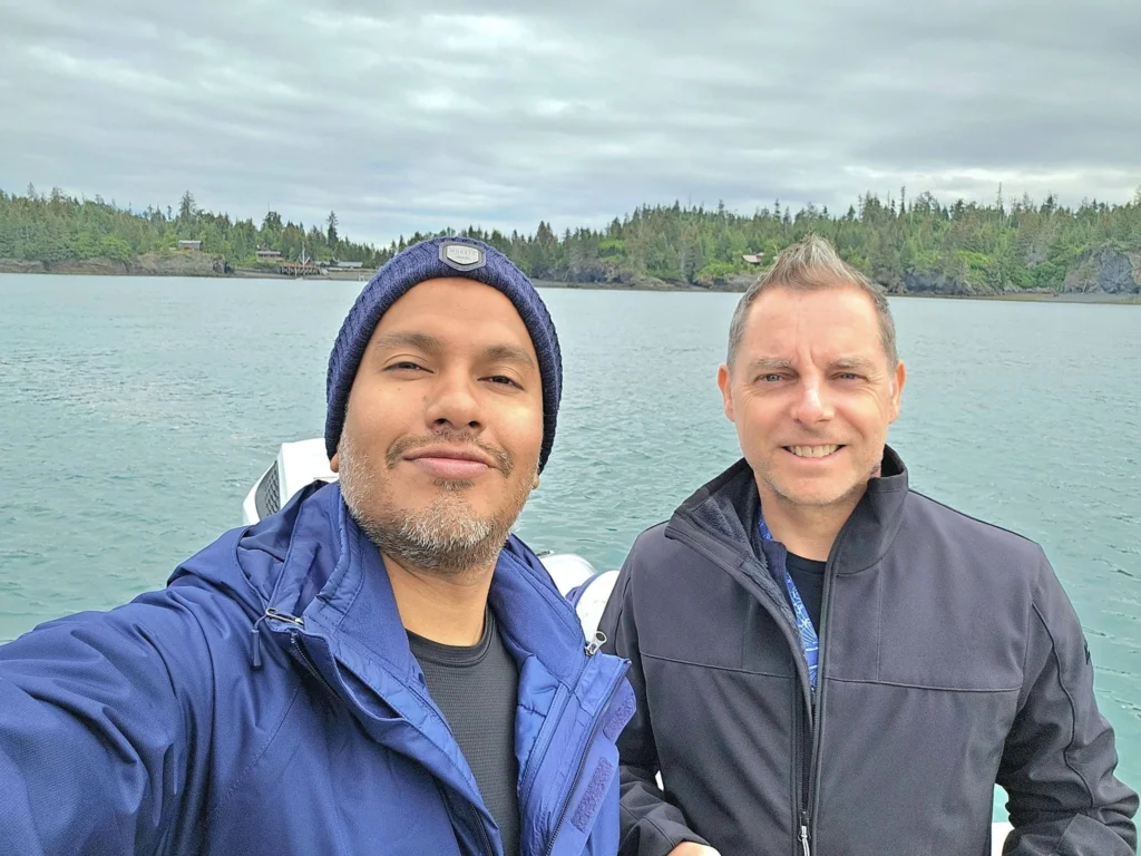 Cruising with Danny and Peter, Holland America Line, Westerdam, Spit (Homer), Alaska, United States | Boat on a morning water tour near Spit with Alaska Water Taxi & Charter, showing seabirds in flight, playful seals in Peterson Bay, sea otters in Cook Inlet, and guests enjoying The Orange Party on the Westerdam. Highlights include scenic boardwalk in Spit and a delicious Alaska seafood boil at Lido Market.