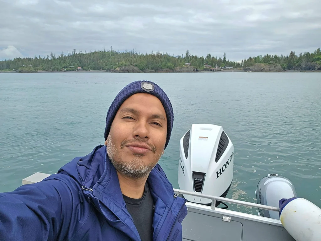 Cruising with Danny and Peter, Holland America Line, Westerdam, Spit (Homer), Alaska, United States | Boat on a morning water tour near Spit with Alaska Water Taxi & Charter, showing seabirds in flight, playful seals in Peterson Bay, sea otters in Cook Inlet, and guests enjoying The Orange Party on the Westerdam. Highlights include scenic boardwalk in Spit and a delicious Alaska seafood boil at Lido Market.