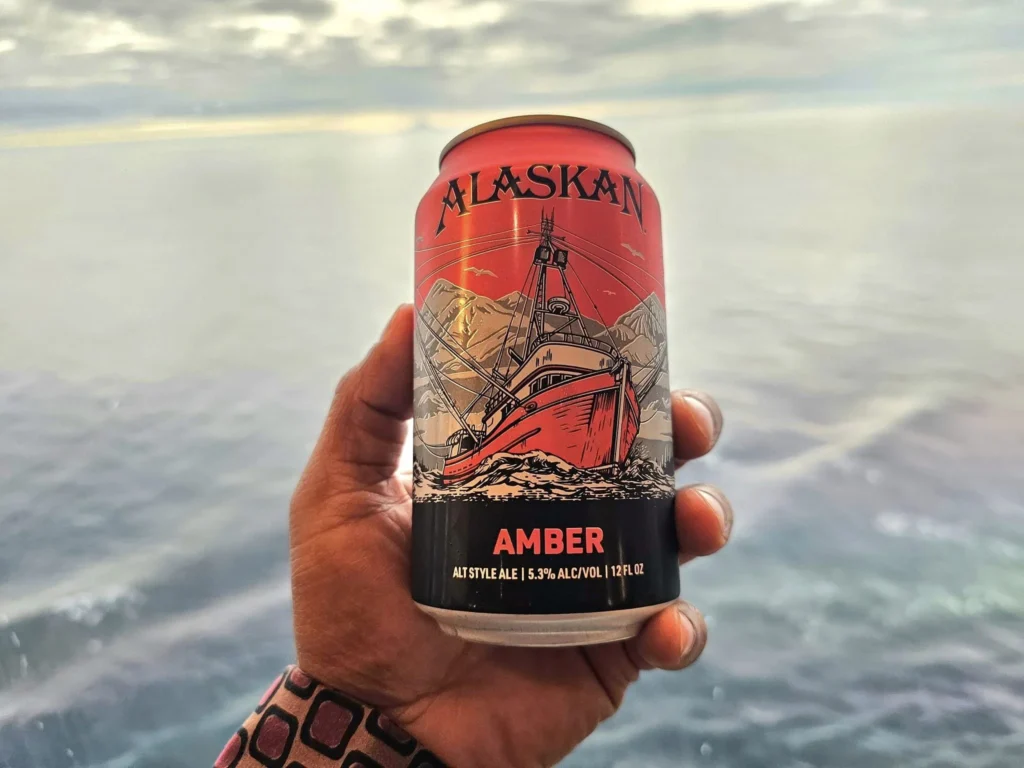 Cruising with Danny and Peter, Holland America Line, Westerdam, Spit (Homer), Alaska, United States | Boat on a morning water tour near Spit with Alaska Water Taxi & Charter, showing seabirds in flight, playful seals in Peterson Bay, sea otters in Cook Inlet, and guests enjoying The Orange Party on the Westerdam. Highlights include scenic boardwalk in Spit and a delicious Alaska seafood boil at Lido Market.