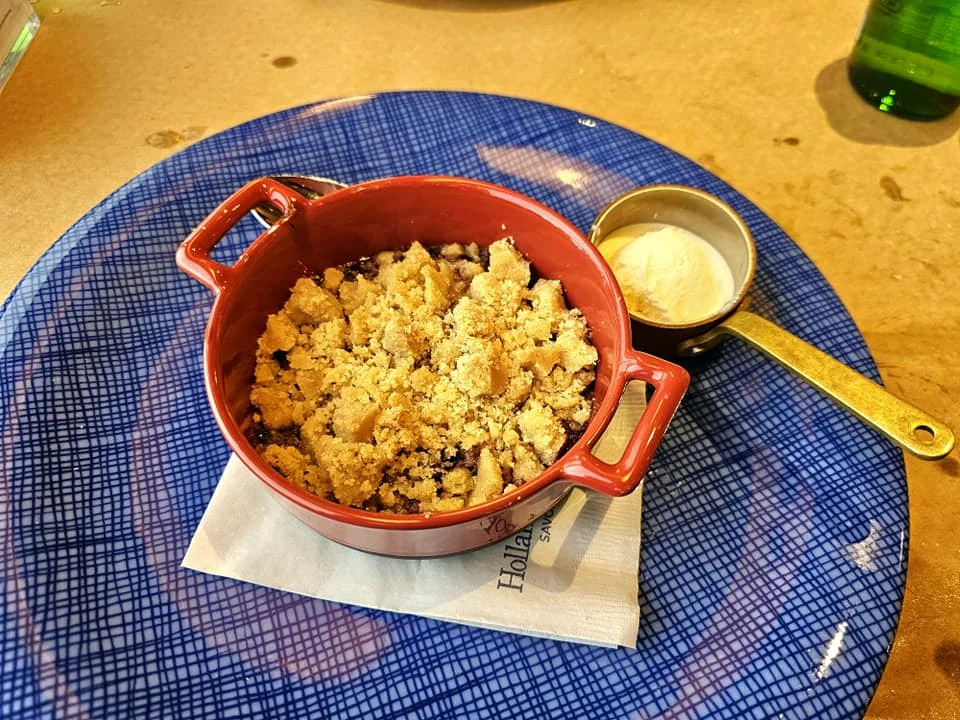 Cruising with Danny and Peter, Holland America Line, Westerdam, Spit (Homer), Alaska, United States | Boat on a morning water tour near Spit with Alaska Water Taxi & Charter, showing seabirds in flight, playful seals in Peterson Bay, sea otters in Cook Inlet, and guests enjoying The Orange Party on the Westerdam. Highlights include scenic boardwalk in Spit and a delicious Alaska seafood boil at Lido Market.