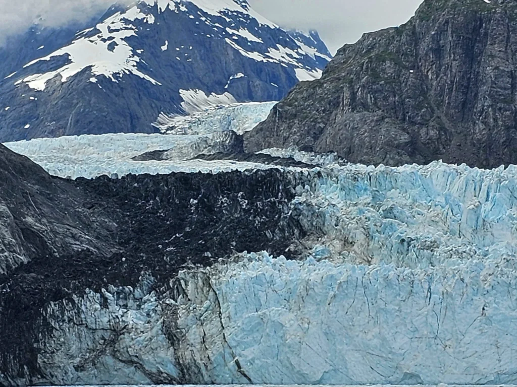 Cruising with Danny and Peter, Holland America Line, Westerdam, Glacier Bay, Alaska, United States | Westerdam cruise ship sailing through Glacier Bay on the Alaska Arctic Circle Solstice Cruise, showcasing stunning glaciers, snow-capped mountains, and diverse wildlife.