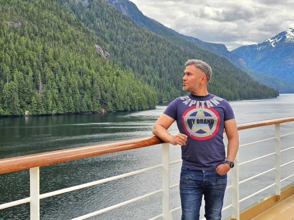 Cruising with Danny and Peter, Holland America Line, Westerdam, Misty Fjords, Alaska, United States | Passengers aboard the Holland America Line's Westerdam transition to the smaller Wilderness Explorer vessel for the Misty Fjords & Wilderness Explorer tour, offering breathtaking views of Misty Fjords National Monument, stunning waterfalls, and diverse wildlife including seals and eagles, all part of the unforgettable Alaska Arctic Circle cruise experience.