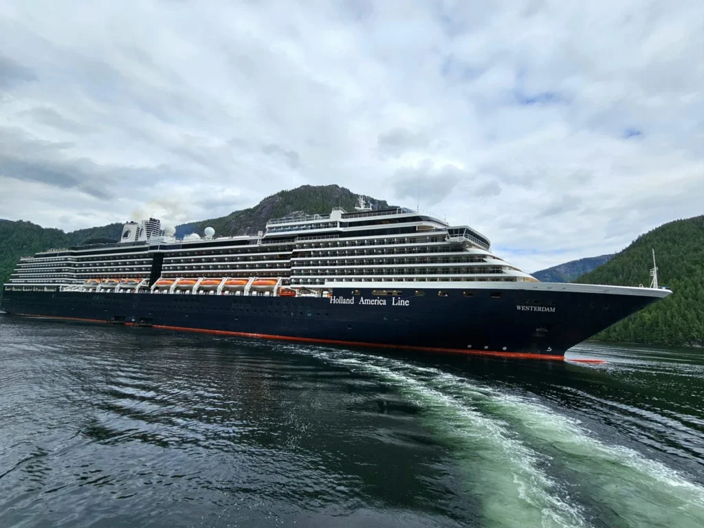 Cruising with Danny and Peter, Holland America Line, Westerdam, Misty Fjords, Alaska, United States | Passengers aboard the Holland America Line's Westerdam transition to the smaller Wilderness Explorer vessel for the Misty Fjords & Wilderness Explorer tour, offering breathtaking views of Misty Fjords National Monument, stunning waterfalls, and diverse wildlife including seals and eagles, all part of the unforgettable Alaska Arctic Circle cruise experience.