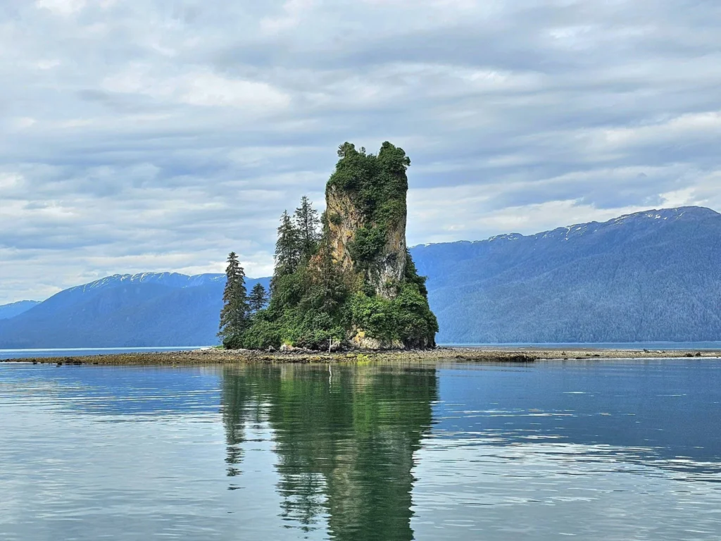 Cruising with Danny and Peter, Holland America Line, Westerdam, Misty Fjords, Alaska, United States | Passengers aboard the Holland America Line's Westerdam transition to the smaller Wilderness Explorer vessel for the Misty Fjords & Wilderness Explorer tour, offering breathtaking views of Misty Fjords National Monument, stunning waterfalls, and diverse wildlife including seals and eagles, all part of the unforgettable Alaska Arctic Circle cruise experience.