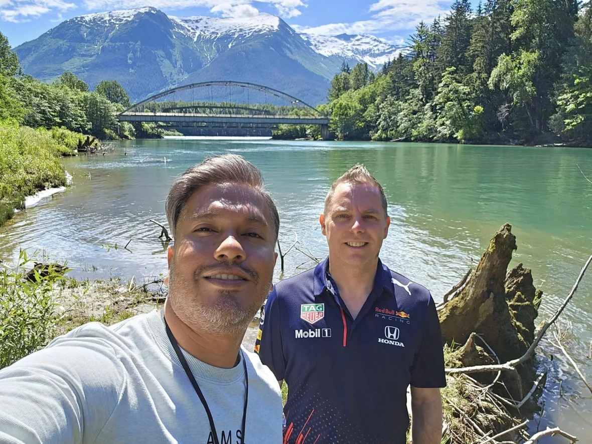 Cruising with Danny and Peter, Holland America Line, Westerdam, Prince Rupert, British Columbia, Canada | In the heart of British Columbia’s wild embrace, Where the Great Bear Rainforest weaves its mystic lace, A journey unfolds, both rail and road in stride, Through nature’s grandeur, where dreams and landscapes collide. From Prince Rupert’s charm, the train departs with grace, A serpentine path through forests’ ancient face, Panoramic windows frame a living, verdant dream, As the Skeena River’s flow whispers its serene theme. Mountains rise like giants, draped in emerald hues, While bald eagles soar, their shadows fleeting views, Black bears wander softly through the forest deep, And mountain goats on rugged cliffs silently leap. Kleanza Creek’s waterfalls cascade with a roar, Nature’s symphony on the rainforest’s floor, And Exchamsiks Park, a jewel of glacial light, Where shimmering pools reflect the day’s pure delight. From rail to road, the scenic drive unveils, A tapestry of mountains and verdant trails, Each turn a canvas painted with the wild’s own hand, A journey through a wonderland, vast and grand. Back in Prince Rupert, where history finds its place, The Museum’s treasures weave a cultural grace, Totem poles and masks tell tales of ancient lore, In this land where the past and present gently soar. Through the Great Bear Rainforest, we wandered wide, In rail and road’s embrace, where nature and culture collide, A journey of wonder, where memories are spun, In the heart of British Columbia, under the sun.