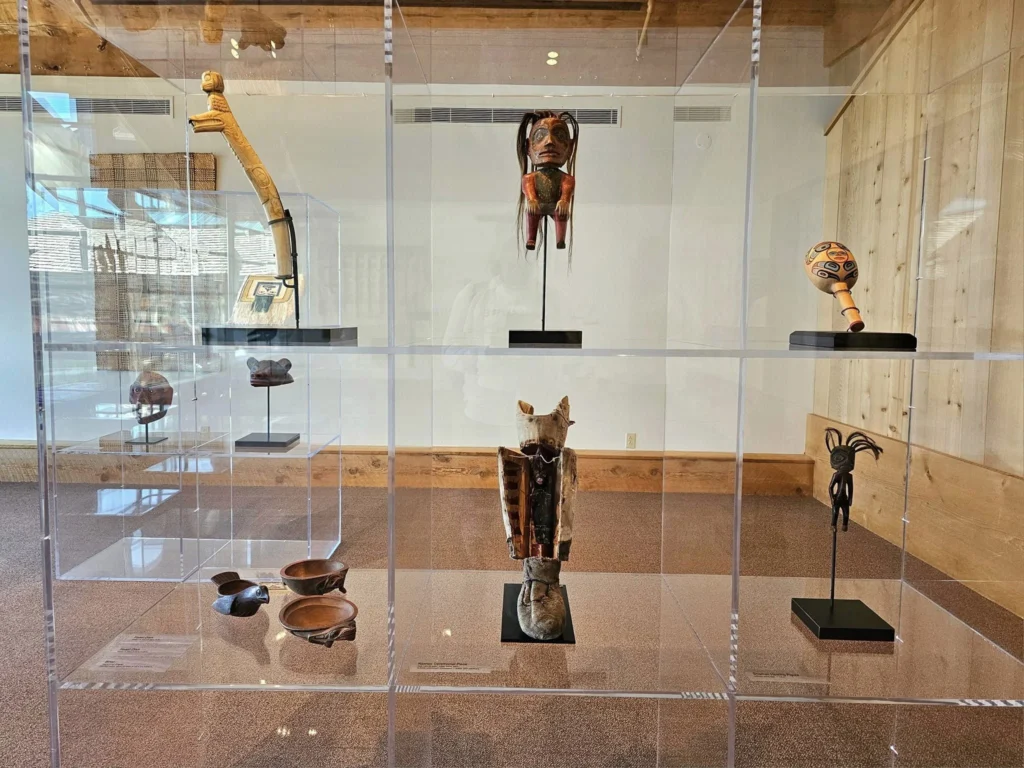 Cruising with Danny and Peter, Holland America Line, Westerdam, Prince Rupert, British Columbia, Canada | In the heart of British Columbia’s wild embrace, Where the Great Bear Rainforest weaves its mystic lace, A journey unfolds, both rail and road in stride, Through nature’s grandeur, where dreams and landscapes collide. From Prince Rupert’s charm, the train departs with grace, A serpentine path through forests’ ancient face, Panoramic windows frame a living, verdant dream, As the Skeena River’s flow whispers its serene theme. Mountains rise like giants, draped in emerald hues, While bald eagles soar, their shadows fleeting views, Black bears wander softly through the forest deep, And mountain goats on rugged cliffs silently leap. Kleanza Creek’s waterfalls cascade with a roar, Nature’s symphony on the rainforest’s floor, And Exchamsiks Park, a jewel of glacial light, Where shimmering pools reflect the day’s pure delight. From rail to road, the scenic drive unveils, A tapestry of mountains and verdant trails, Each turn a canvas painted with the wild’s own hand, A journey through a wonderland, vast and grand. Back in Prince Rupert, where history finds its place, The Museum’s treasures weave a cultural grace, Totem poles and masks tell tales of ancient lore, In this land where the past and present gently soar. Through the Great Bear Rainforest, we wandered wide, In rail and road’s embrace, where nature and culture collide, A journey of wonder, where memories are spun, In the heart of British Columbia, under the sun.