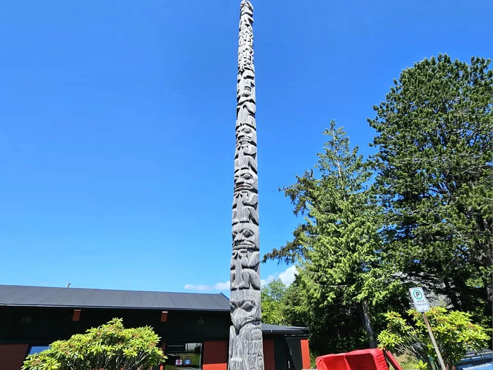 Cruising with Danny and Peter, Holland America Line, Westerdam, Prince Rupert, British Columbia, Canada | In the heart of British Columbia’s wild embrace, Where the Great Bear Rainforest weaves its mystic lace, A journey unfolds, both rail and road in stride, Through nature’s grandeur, where dreams and landscapes collide. From Prince Rupert’s charm, the train departs with grace, A serpentine path through forests’ ancient face, Panoramic windows frame a living, verdant dream, As the Skeena River’s flow whispers its serene theme. Mountains rise like giants, draped in emerald hues, While bald eagles soar, their shadows fleeting views, Black bears wander softly through the forest deep, And mountain goats on rugged cliffs silently leap. Kleanza Creek’s waterfalls cascade with a roar, Nature’s symphony on the rainforest’s floor, And Exchamsiks Park, a jewel of glacial light, Where shimmering pools reflect the day’s pure delight. From rail to road, the scenic drive unveils, A tapestry of mountains and verdant trails, Each turn a canvas painted with the wild’s own hand, A journey through a wonderland, vast and grand. Back in Prince Rupert, where history finds its place, The Museum’s treasures weave a cultural grace, Totem poles and masks tell tales of ancient lore, In this land where the past and present gently soar. Through the Great Bear Rainforest, we wandered wide, In rail and road’s embrace, where nature and culture collide, A journey of wonder, where memories are spun, In the heart of British Columbia, under the sun.