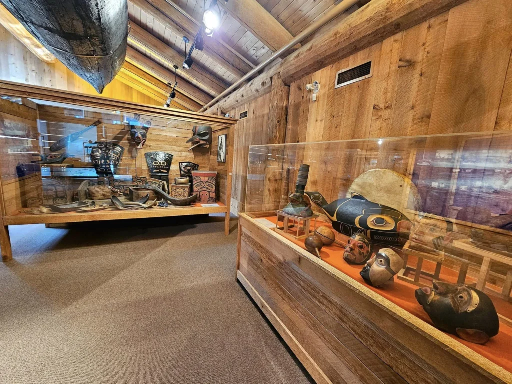 Cruising with Danny and Peter, Holland America Line, Westerdam, Prince Rupert, British Columbia, Canada | In the heart of British Columbia’s wild embrace, Where the Great Bear Rainforest weaves its mystic lace, A journey unfolds, both rail and road in stride, Through nature’s grandeur, where dreams and landscapes collide. From Prince Rupert’s charm, the train departs with grace, A serpentine path through forests’ ancient face, Panoramic windows frame a living, verdant dream, As the Skeena River’s flow whispers its serene theme. Mountains rise like giants, draped in emerald hues, While bald eagles soar, their shadows fleeting views, Black bears wander softly through the forest deep, And mountain goats on rugged cliffs silently leap. Kleanza Creek’s waterfalls cascade with a roar, Nature’s symphony on the rainforest’s floor, And Exchamsiks Park, a jewel of glacial light, Where shimmering pools reflect the day’s pure delight. From rail to road, the scenic drive unveils, A tapestry of mountains and verdant trails, Each turn a canvas painted with the wild’s own hand, A journey through a wonderland, vast and grand. Back in Prince Rupert, where history finds its place, The Museum’s treasures weave a cultural grace, Totem poles and masks tell tales of ancient lore, In this land where the past and present gently soar. Through the Great Bear Rainforest, we wandered wide, In rail and road’s embrace, where nature and culture collide, A journey of wonder, where memories are spun, In the heart of British Columbia, under the sun.