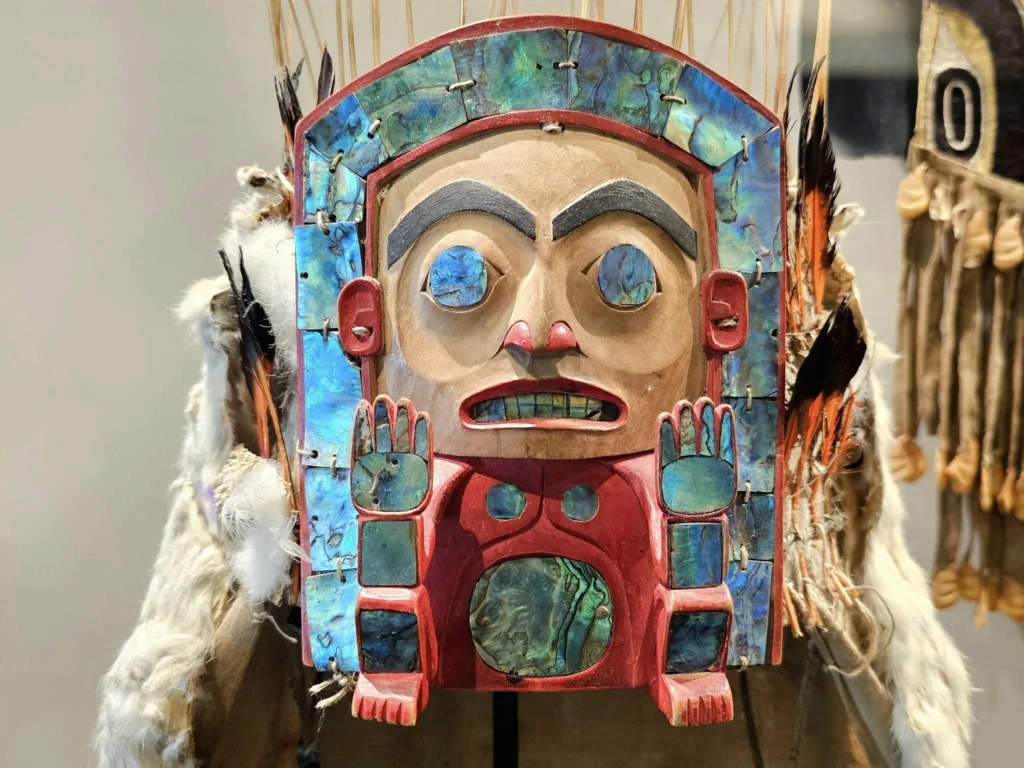 Cruising with Danny and Peter, Holland America Line, Westerdam, Prince Rupert, British Columbia, Canada | In the heart of British Columbia’s wild embrace, Where the Great Bear Rainforest weaves its mystic lace, A journey unfolds, both rail and road in stride, Through nature’s grandeur, where dreams and landscapes collide. From Prince Rupert’s charm, the train departs with grace, A serpentine path through forests’ ancient face, Panoramic windows frame a living, verdant dream, As the Skeena River’s flow whispers its serene theme. Mountains rise like giants, draped in emerald hues, While bald eagles soar, their shadows fleeting views, Black bears wander softly through the forest deep, And mountain goats on rugged cliffs silently leap. Kleanza Creek’s waterfalls cascade with a roar, Nature’s symphony on the rainforest’s floor, And Exchamsiks Park, a jewel of glacial light, Where shimmering pools reflect the day’s pure delight. From rail to road, the scenic drive unveils, A tapestry of mountains and verdant trails, Each turn a canvas painted with the wild’s own hand, A journey through a wonderland, vast and grand. Back in Prince Rupert, where history finds its place, The Museum’s treasures weave a cultural grace, Totem poles and masks tell tales of ancient lore, In this land where the past and present gently soar. Through the Great Bear Rainforest, we wandered wide, In rail and road’s embrace, where nature and culture collide, A journey of wonder, where memories are spun, In the heart of British Columbia, under the sun.