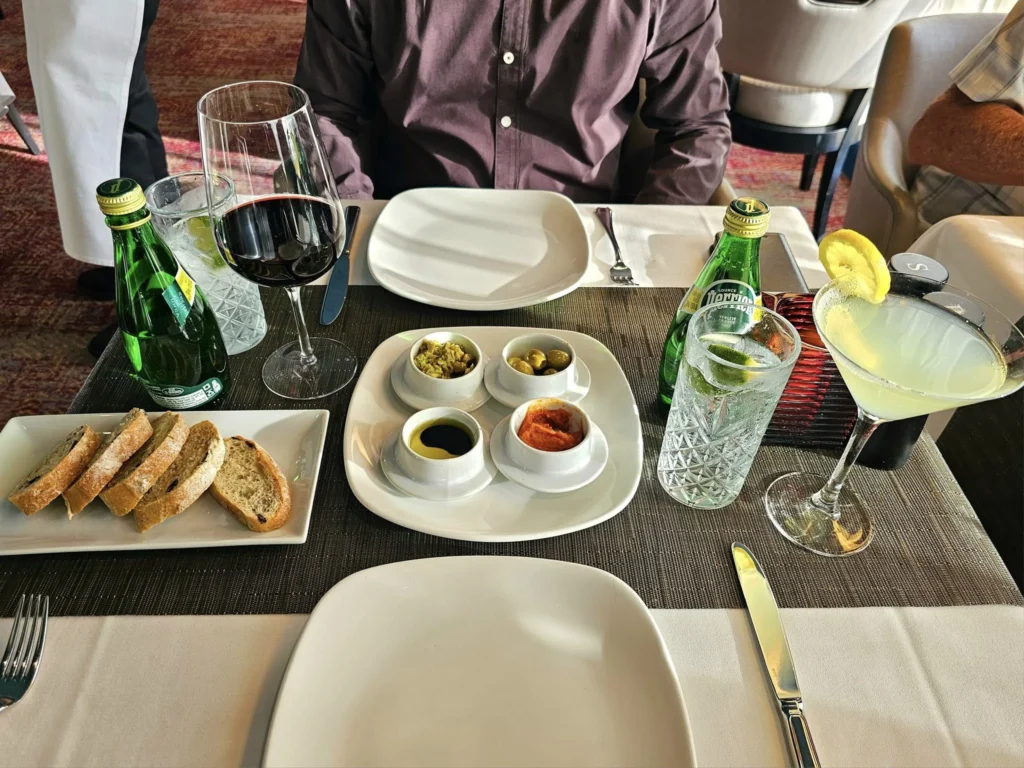 Cruising with Danny and Peter, Holland America Line, Westerdam, Seattle, Washington, United States | Stunning sunset over the ocean during a magical evening cruise from Prince Rupert on the Westerdam, with vibrant orange and pink skies reflecting on calm waters.