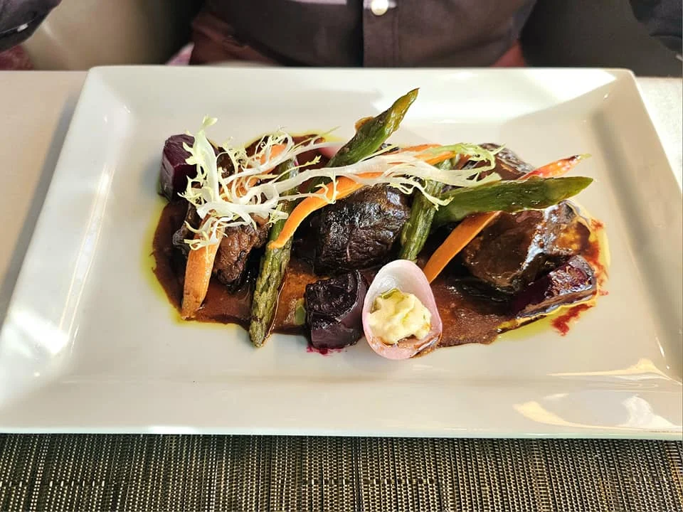 Cruising with Danny and Peter, Holland America Line, Westerdam, Seattle, Washington, United States | Stunning sunset over the ocean during a magical evening cruise from Prince Rupert on the Westerdam, with vibrant orange and pink skies reflecting on calm waters.