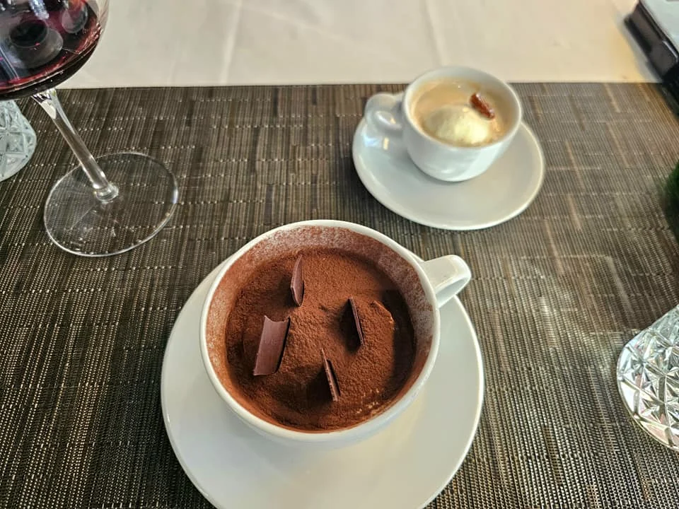 Cruising with Danny and Peter, Holland America Line, Westerdam, Seattle, Washington, United States | Stunning sunset over the ocean during a magical evening cruise from Prince Rupert on the Westerdam, with vibrant orange and pink skies reflecting on calm waters.