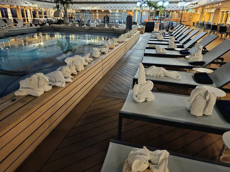 Cruising with Danny and Peter, Holland America Line, Westerdam, Seattle, Washington, United States | Stunning sunset over the ocean during a magical evening cruise from Prince Rupert on the Westerdam, with vibrant orange and pink skies reflecting on calm waters.