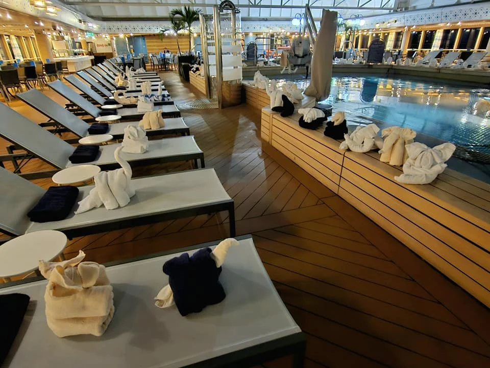 Cruising with Danny and Peter, Holland America Line, Westerdam, Seattle, Washington, United States | Stunning sunset over the ocean during a magical evening cruise from Prince Rupert on the Westerdam, with vibrant orange and pink skies reflecting on calm waters.