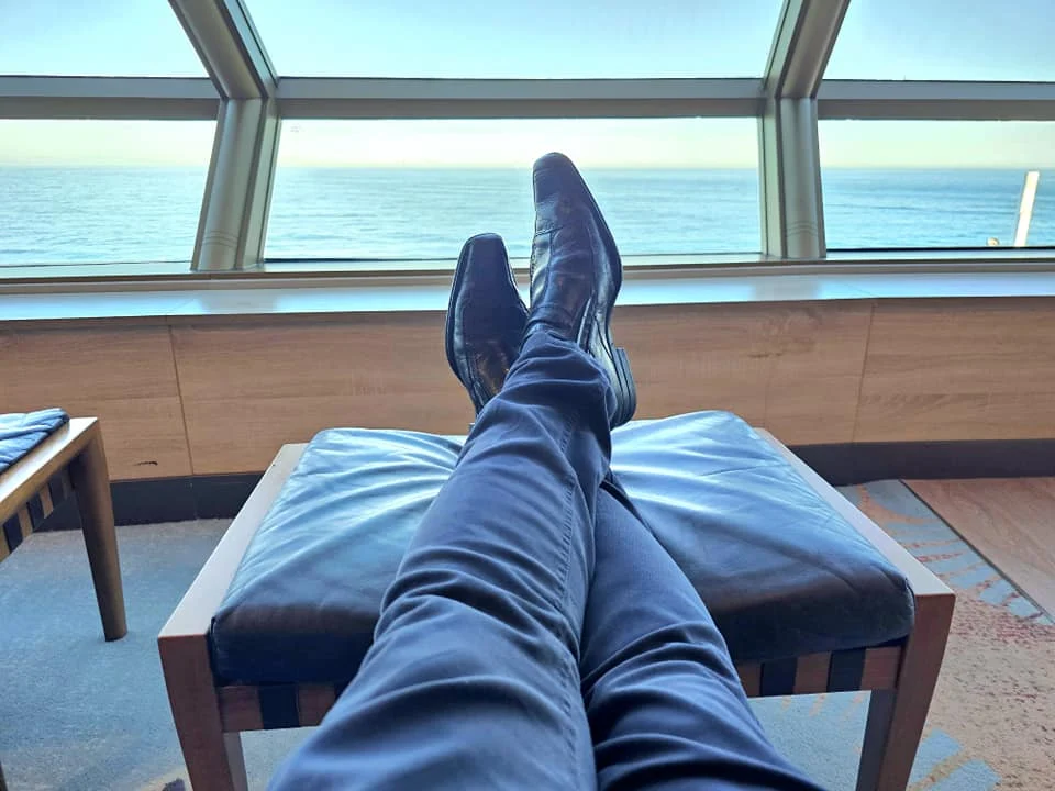 Cruising with Danny and Peter, Holland America Line, Westerdam, Seattle, Washington, United States | Stunning sunset over the ocean during a magical evening cruise from Prince Rupert on the Westerdam, with vibrant orange and pink skies reflecting on calm waters.