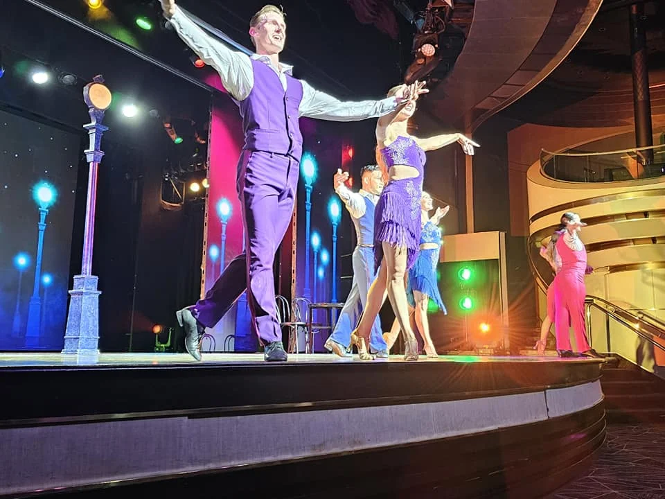 Cruising with Danny and Peter, Holland America Line, Westerdam, Seattle, Washington, United States | Stunning sunset over the ocean during a magical evening cruise from Prince Rupert on the Westerdam, with vibrant orange and pink skies reflecting on calm waters.