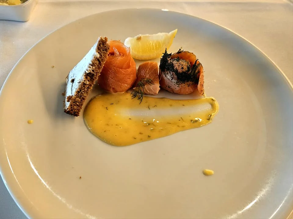 Cruising with Danny and Peter, Holland America Line, Westerdam, Seattle, Washington, United States | Stunning sunset over the ocean during a magical evening cruise from Prince Rupert on the Westerdam, with vibrant orange and pink skies reflecting on calm waters.