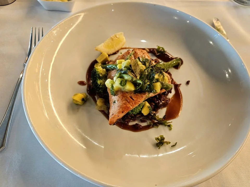 Cruising with Danny and Peter, Holland America Line, Westerdam, Seattle, Washington, United States | Stunning sunset over the ocean during a magical evening cruise from Prince Rupert on the Westerdam, with vibrant orange and pink skies reflecting on calm waters.