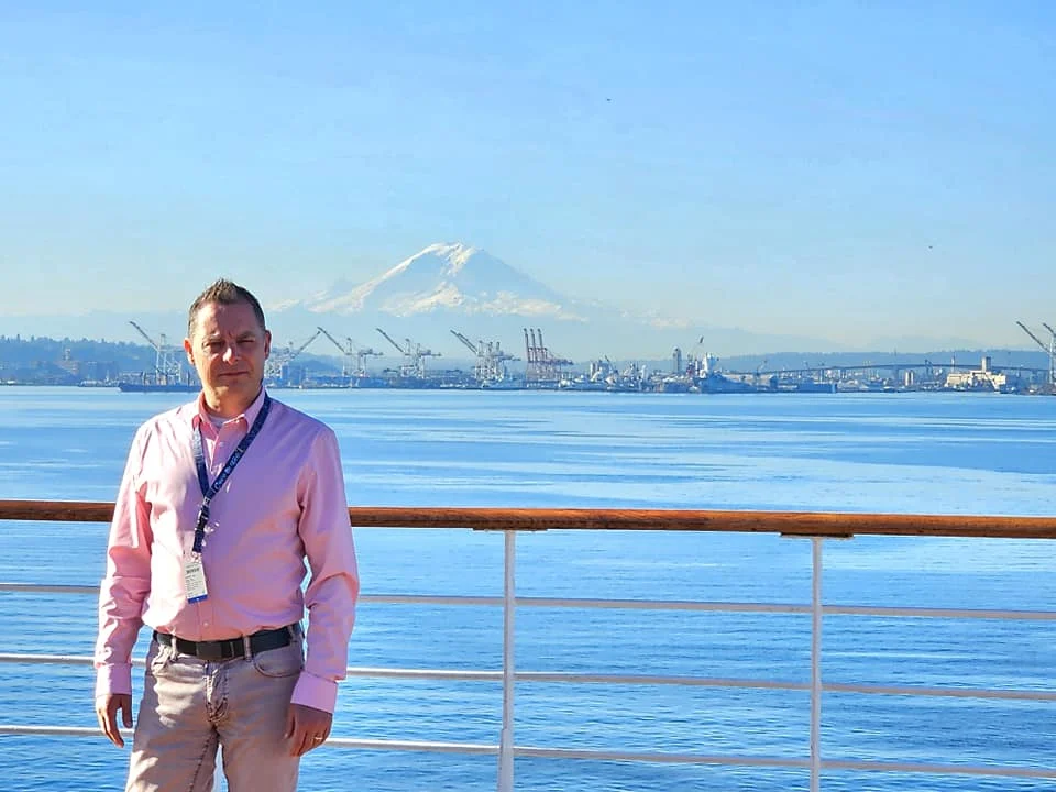 Cruising with Danny and Peter, Holland America Line, Westerdam, Seattle, Washington, United States | Stunning sunset over the ocean during a magical evening cruise from Prince Rupert on the Westerdam, with vibrant orange and pink skies reflecting on calm waters.