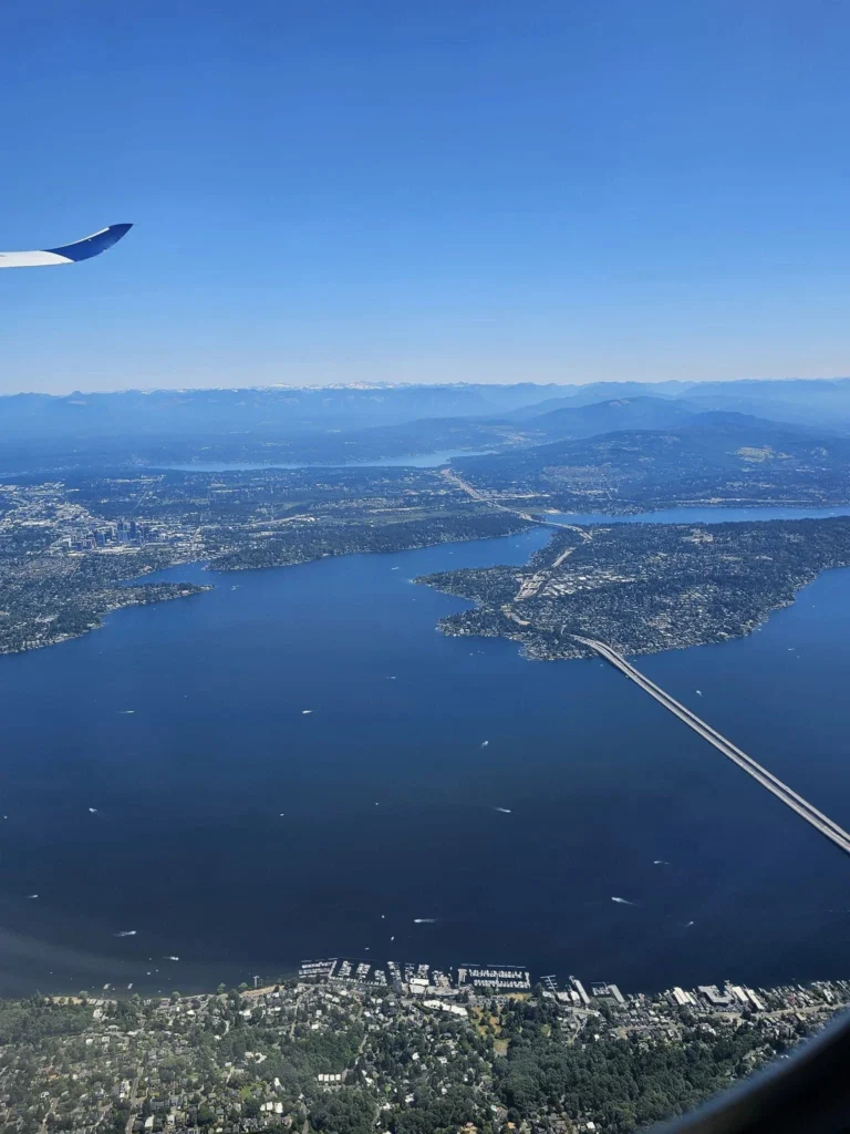 Cruising with Danny and Peter, Holland America Line, Westerdam, Seattle, Washington, United States | Aerial view of the MS Westerdam cruise ship sailing through Alaska’s stunning glaciers, showcasing the luxurious cruise experience and breathtaking scenery.
