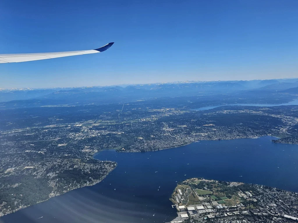 Cruising with Danny and Peter, Holland America Line, Westerdam, Seattle, Washington, United States | Aerial view of the MS Westerdam cruise ship sailing through Alaska’s stunning glaciers, showcasing the luxurious cruise experience and breathtaking scenery.