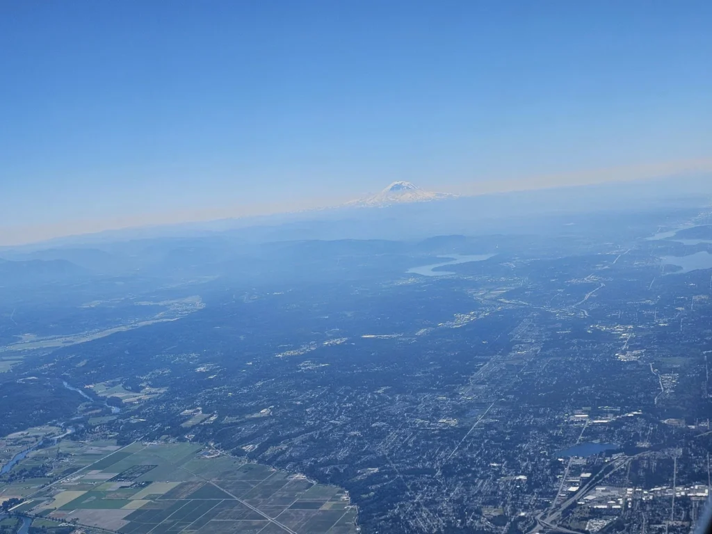 Cruising with Danny and Peter, Holland America Line, Westerdam, Seattle, Washington, United States | Aerial view of the MS Westerdam cruise ship sailing through Alaska’s stunning glaciers, showcasing the luxurious cruise experience and breathtaking scenery.