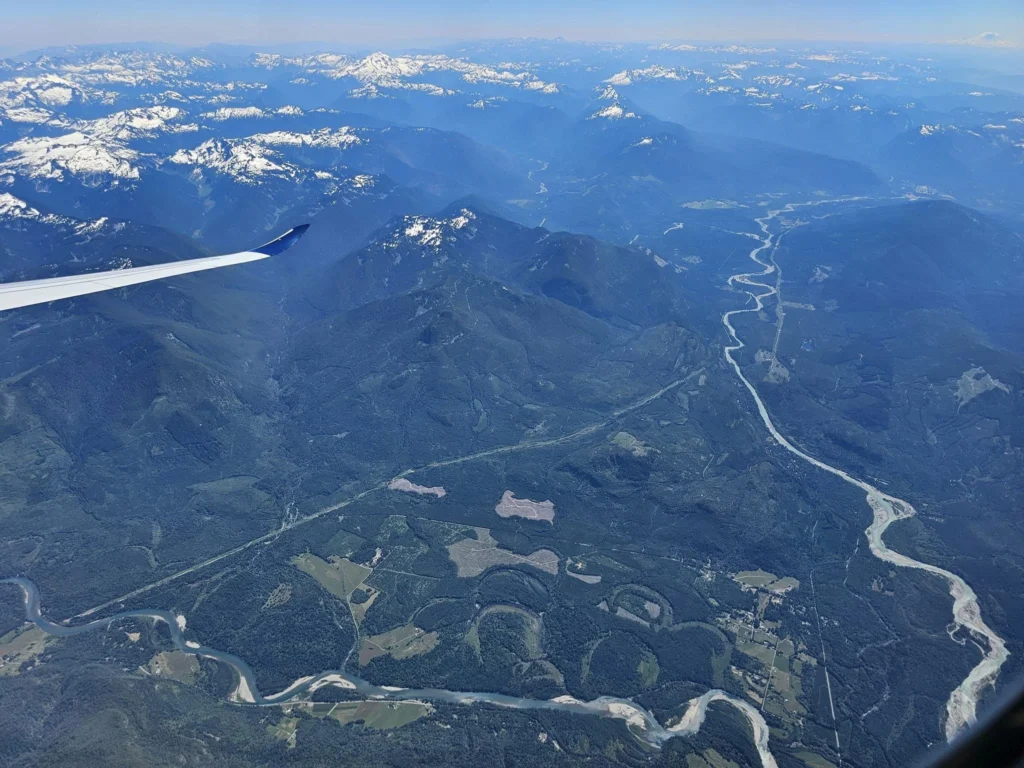 Cruising with Danny and Peter, Holland America Line, Westerdam, Seattle, Washington, United States | Aerial view of the MS Westerdam cruise ship sailing through Alaska’s stunning glaciers, showcasing the luxurious cruise experience and breathtaking scenery.