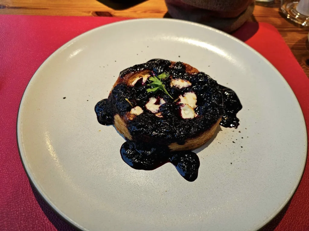 Cruising with Danny and Peter, MSC Cruises, MSC Preziosa, Rotterdam, The Netherlands, Birthday Cruise | The majestic MSC Preziosa cruise ship docked at Rotterdam’s Cruise Terminal on Wilhelminakade, its sleek white exterior gleaming against the modern city skyline with the iconic Erasmus Bridge in the background. Passengers board for a Northern Europe mini-cruise, celebrating a birthday with luxurious touches like a chilled bottle of Spumante and macarons in a stylish cabin. The vibrant onboard atmosphere features a gourmet dining experience at Butcher’s Cut Chef’s Table with a surprise birthday cake, thrilling entertainment at the Platinum Theater’s Rock Nation show with singers and dancers, and a lively Silent Disco in the Safari Lounge. The scene captures the excitement of embarkation day, with scenic views of Rotterdam’s waterfront, onboard shopping for MSC souvenirs, and the promise of an unforgettable luxury cruise vacation.