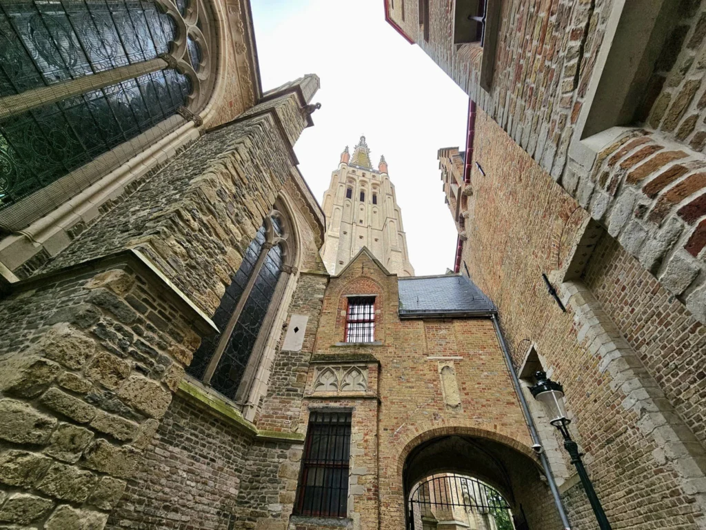 Cruising with Danny and Peter, MSC Cruises, MSC Preziosa, Zeebrugge, Brugge, Brussels, Belgium | Pictures from our Bruges day trip during the MSC Cruises Bruges excursion, showcasing the stunning Market Square Bruges, the iconic Belfry Tower Bruges, a scenic Belgium canal cruise, and beautiful views of the Chapel of the Holy Blood, along with delightful moments at the Butcher’s Cut restaurant and the MSC Voyagers Club event in the Safari Lounge MSC Preziosa.