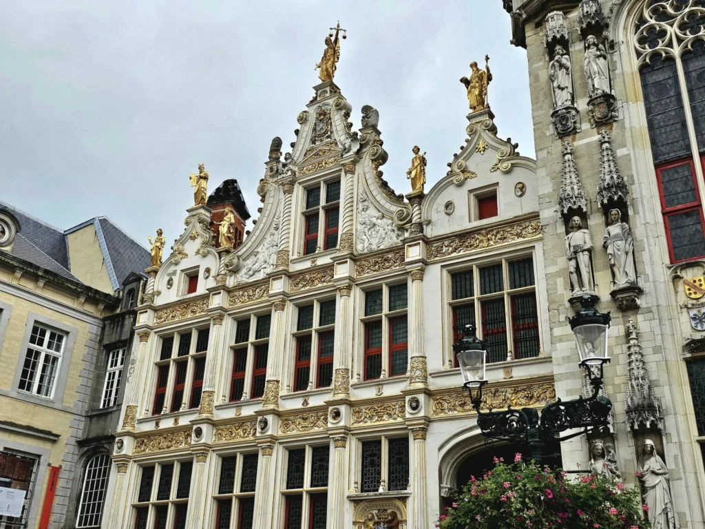 Cruising with Danny and Peter, MSC Cruises, MSC Preziosa, Zeebrugge, Brugge, Brussels, Belgium | Pictures from our Bruges day trip during the MSC Cruises Bruges excursion, showcasing the stunning Market Square Bruges, the iconic Belfry Tower Bruges, a scenic Belgium canal cruise, and beautiful views of the Chapel of the Holy Blood, along with delightful moments at the Butcher’s Cut restaurant and the MSC Voyagers Club event in the Safari Lounge MSC Preziosa.