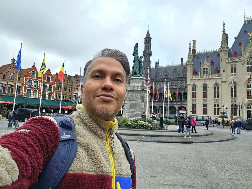 Cruising with Danny and Peter, MSC Cruises, MSC Preziosa, Zeebrugge, Brugge, Brussels, Belgium | Pictures from our Bruges day trip during the MSC Cruises Bruges excursion, showcasing the stunning Market Square Bruges, the iconic Belfry Tower Bruges, a scenic Belgium canal cruise, and beautiful views of the Chapel of the Holy Blood, along with delightful moments at the Butcher’s Cut restaurant and the MSC Voyagers Club event in the Safari Lounge MSC Preziosa.