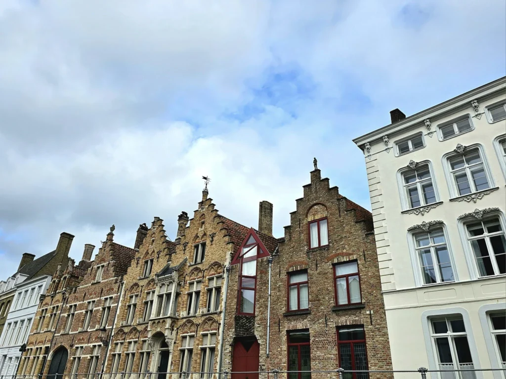 Cruising with Danny and Peter, MSC Cruises, MSC Preziosa, Zeebrugge, Brugge, Brussels, Belgium | Pictures from our Bruges day trip during the MSC Cruises Bruges excursion, showcasing the stunning Market Square Bruges, the iconic Belfry Tower Bruges, a scenic Belgium canal cruise, and beautiful views of the Chapel of the Holy Blood, along with delightful moments at the Butcher’s Cut restaurant and the MSC Voyagers Club event in the Safari Lounge MSC Preziosa.