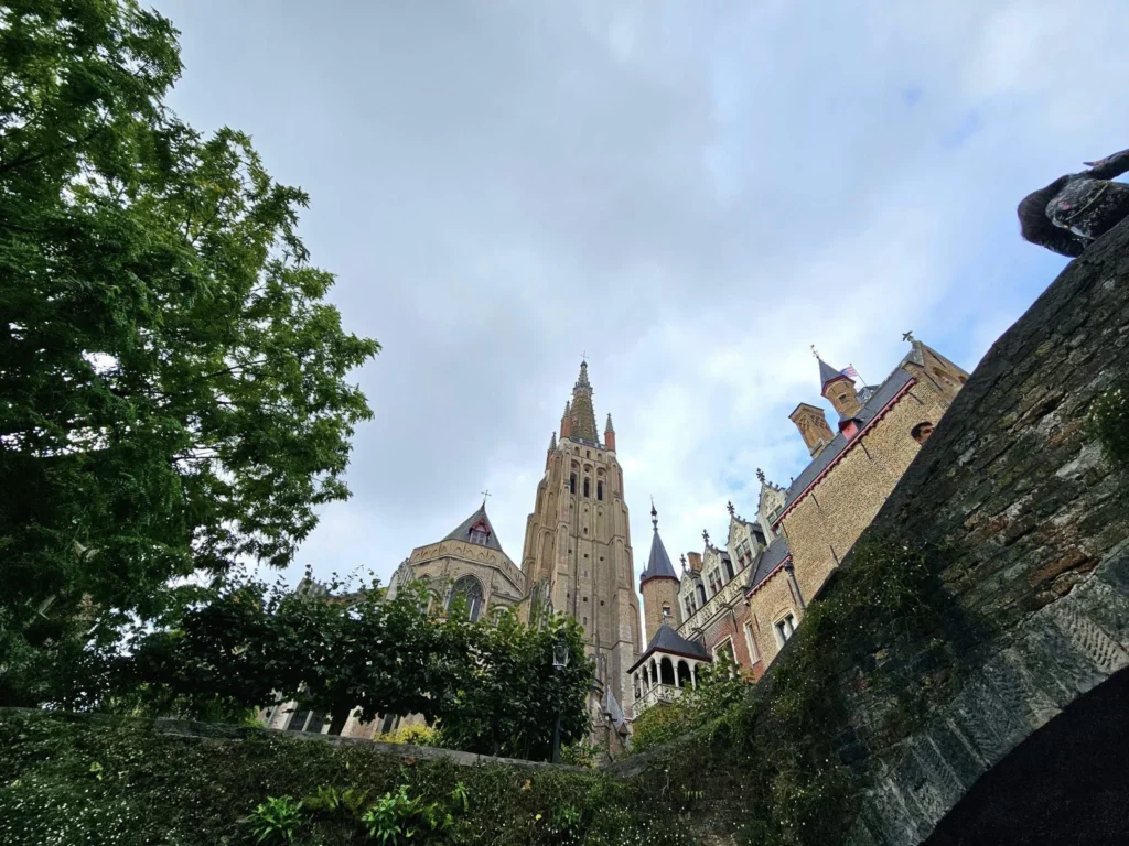 Cruising with Danny and Peter, MSC Cruises, MSC Preziosa, Zeebrugge, Brugge, Brussels, Belgium | Pictures from our Bruges day trip during the MSC Cruises Bruges excursion, showcasing the stunning Market Square Bruges, the iconic Belfry Tower Bruges, a scenic Belgium canal cruise, and beautiful views of the Chapel of the Holy Blood, along with delightful moments at the Butcher’s Cut restaurant and the MSC Voyagers Club event in the Safari Lounge MSC Preziosa.