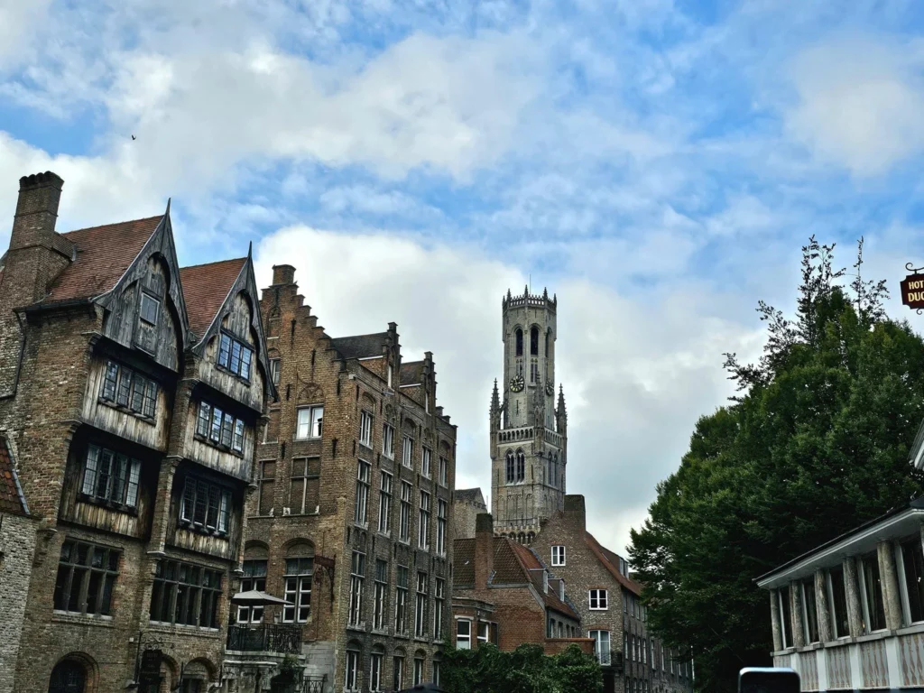 Cruising with Danny and Peter, MSC Cruises, MSC Preziosa, Zeebrugge, Brugge, Brussels, Belgium | Pictures from our Bruges day trip during the MSC Cruises Bruges excursion, showcasing the stunning Market Square Bruges, the iconic Belfry Tower Bruges, a scenic Belgium canal cruise, and beautiful views of the Chapel of the Holy Blood, along with delightful moments at the Butcher’s Cut restaurant and the MSC Voyagers Club event in the Safari Lounge MSC Preziosa.