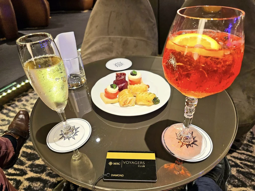 Cruising with Danny and Peter, MSC Cruises, MSC Preziosa, Zeebrugge, Brugge, Brussels, Belgium | Pictures from our Bruges day trip during the MSC Cruises Bruges excursion, showcasing the stunning Market Square Bruges, the iconic Belfry Tower Bruges, a scenic Belgium canal cruise, and beautiful views of the Chapel of the Holy Blood, along with delightful moments at the Butcher’s Cut restaurant and the MSC Voyagers Club event in the Safari Lounge MSC Preziosa.