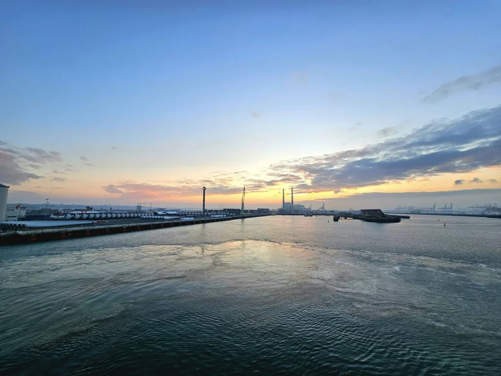 Cruising with Danny and Peter, MSC Cruises, MSC Preziosa, Le Havre, Paris, Étretat, France | Stunning views of the Étretat natural arches against the Normandy coastline, featuring the iconic L'Aiguille rock formation, picturesque half-timbered houses in Étretat, and travelers enjoying scenic walks along the cliffs during the unguided tour from MSC Preziosa.