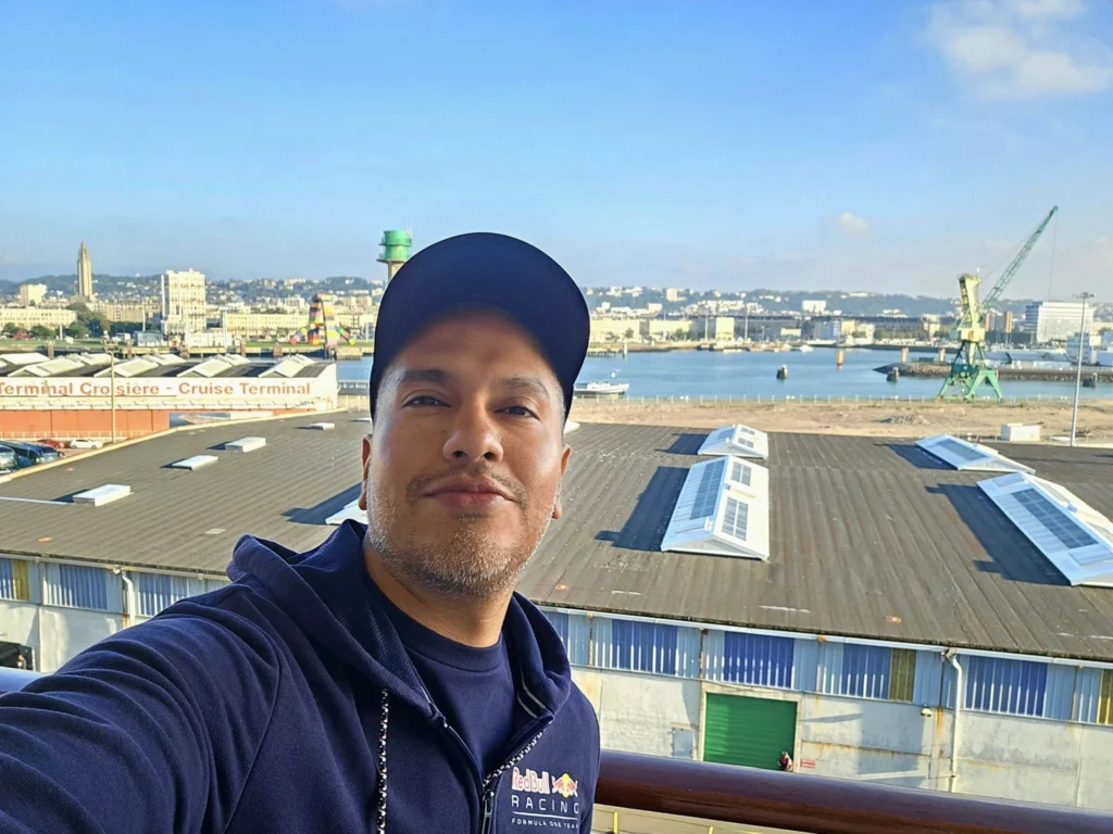 Cruising with Danny and Peter, MSC Cruises, MSC Preziosa, Le Havre, Paris, Étretat, France | Stunning views of the Étretat natural arches against the Normandy coastline, featuring the iconic L'Aiguille rock formation, picturesque half-timbered houses in Étretat, and travelers enjoying scenic walks along the cliffs during the unguided tour from MSC Preziosa.