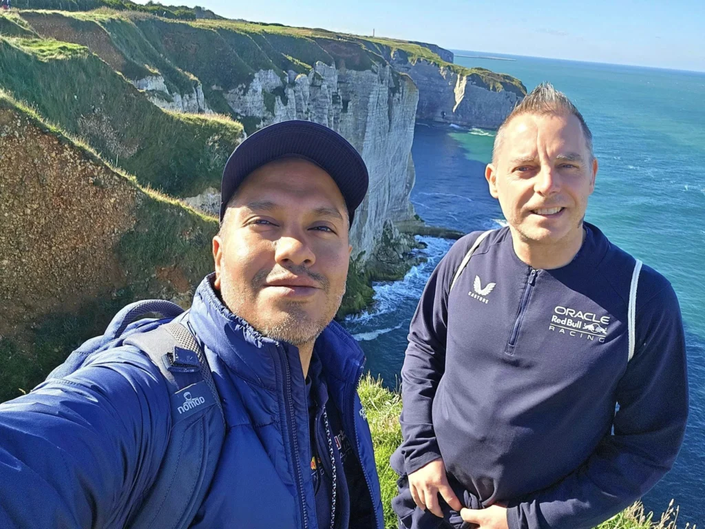 Cruising with Danny and Peter, MSC Cruises, MSC Preziosa, Le Havre, Paris, Étretat, France | Stunning views of the Étretat natural arches against the Normandy coastline, featuring the iconic L'Aiguille rock formation, picturesque half-timbered houses in Étretat, and travelers enjoying scenic walks along the cliffs during the unguided tour from MSC Preziosa.