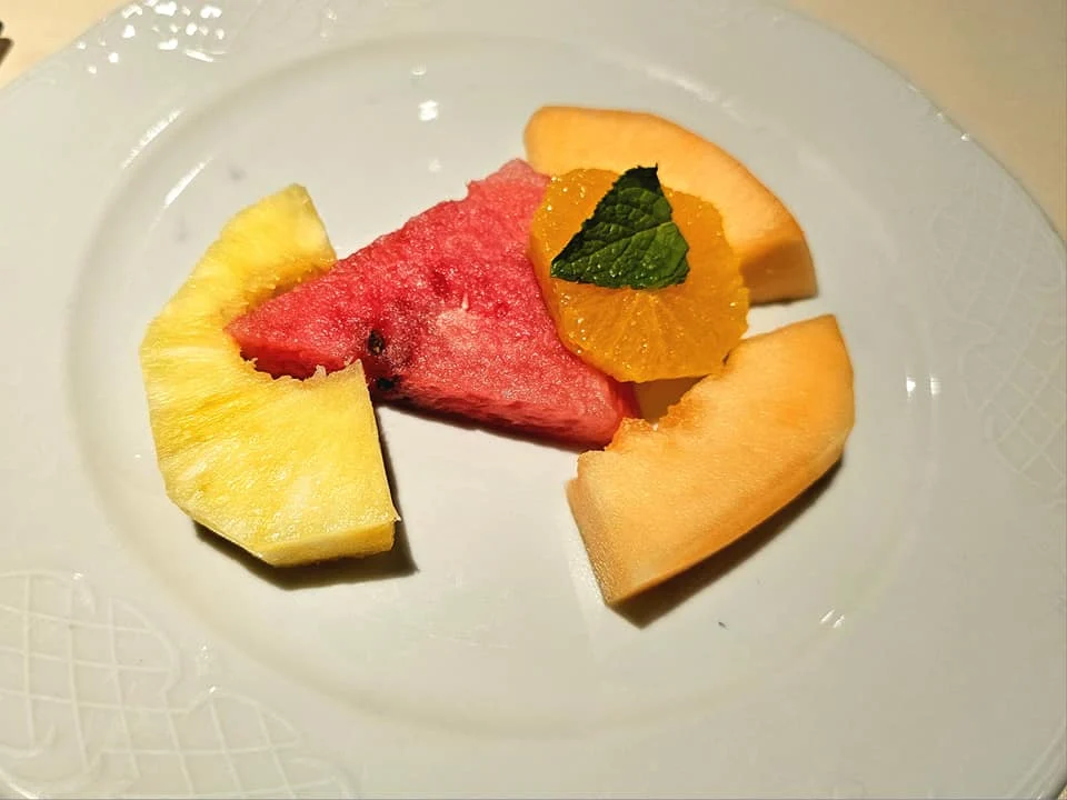 Cruising with Danny and Peter, MSC Cruises, MSC Preziosa, Le Havre, Paris, Étretat, France | Stunning views of the Étretat natural arches against the Normandy coastline, featuring the iconic L'Aiguille rock formation, picturesque half-timbered houses in Étretat, and travelers enjoying scenic walks along the cliffs during the unguided tour from MSC Preziosa.